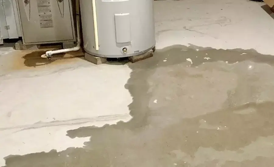 Water spreading across the floor from a leaking water heater in Wake Forest